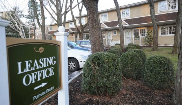 Image of sign pointing to apartment office