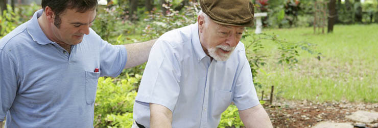 Image of an adult son walking with his father